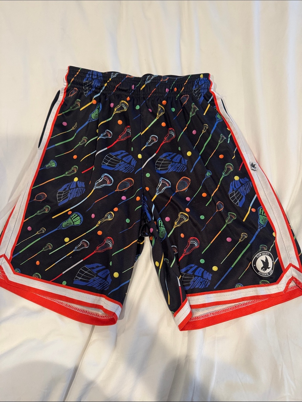 Flow Society Black Lacrosse Print Athletic Shorts with orange trim